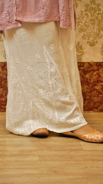 Close-up of detailed Lucknowi hand embroidery on a white Kali Palazzo. Shows skin-friendly bottom wear.