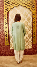 View a comfortable white Afghani pant, designed for a relaxed fit. Elegant ethnic bottom wear.