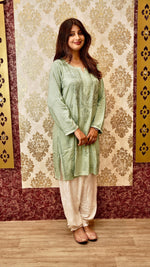 View a comfortable white Afghani pant with elegant Lucknowi Chikankari. Versatile bottom wear for women.