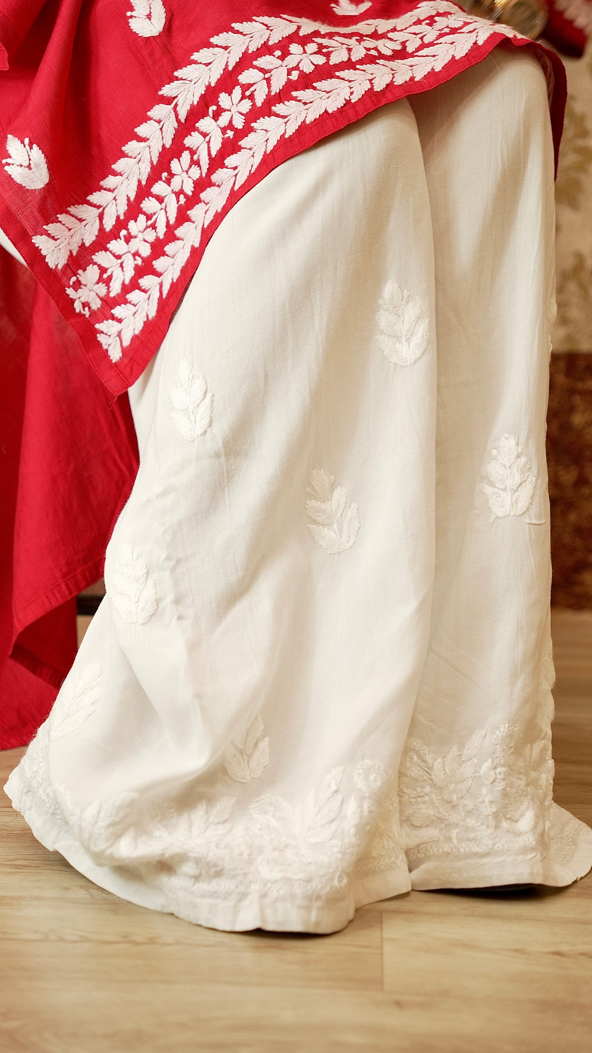  Close-up of breathable rayon cotton fabric and fine Lucknowi handwork on a palazzo. Perfect summer bottom wear.
