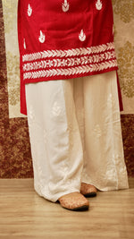 View a wide and comfortable rayon cotton palazzo, with elegant Lucknowi hand embroidery. Modern ethnic bottom wear.