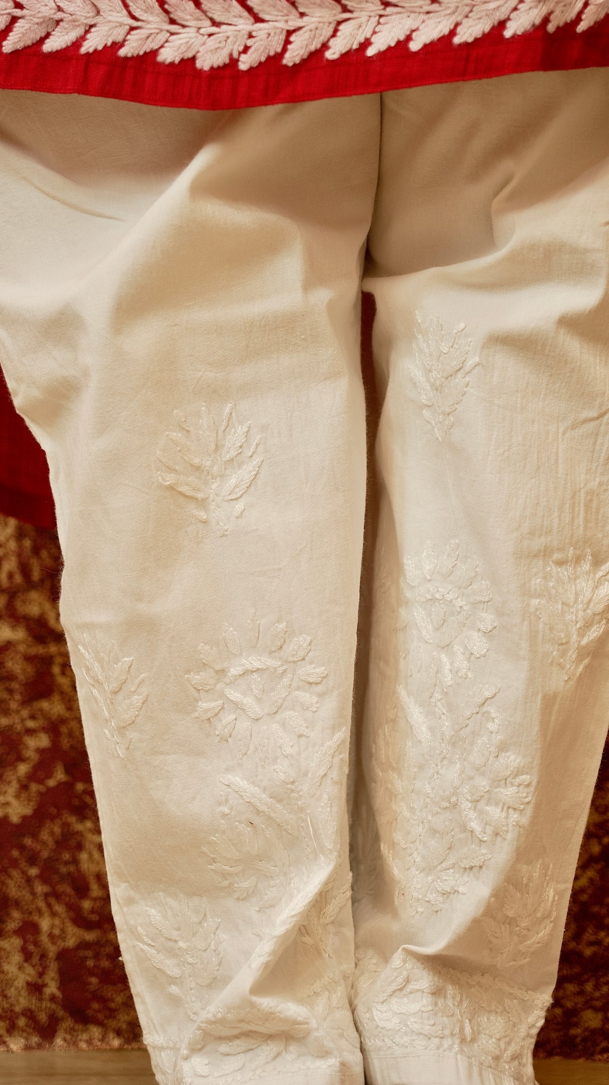Close-up of embroidered cotton lycra shalwar. View traditional Chikankari pants, ideal for comfort and style.