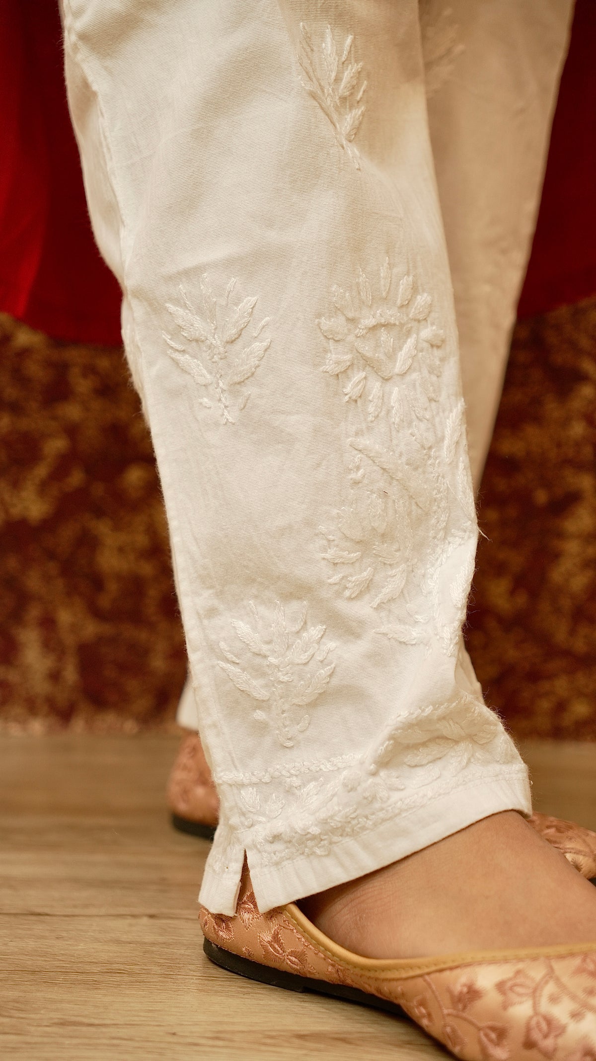 Close-up of cotton lycra pants with Chikankari work. View comfortable and fashionable embroidered cotton pants.