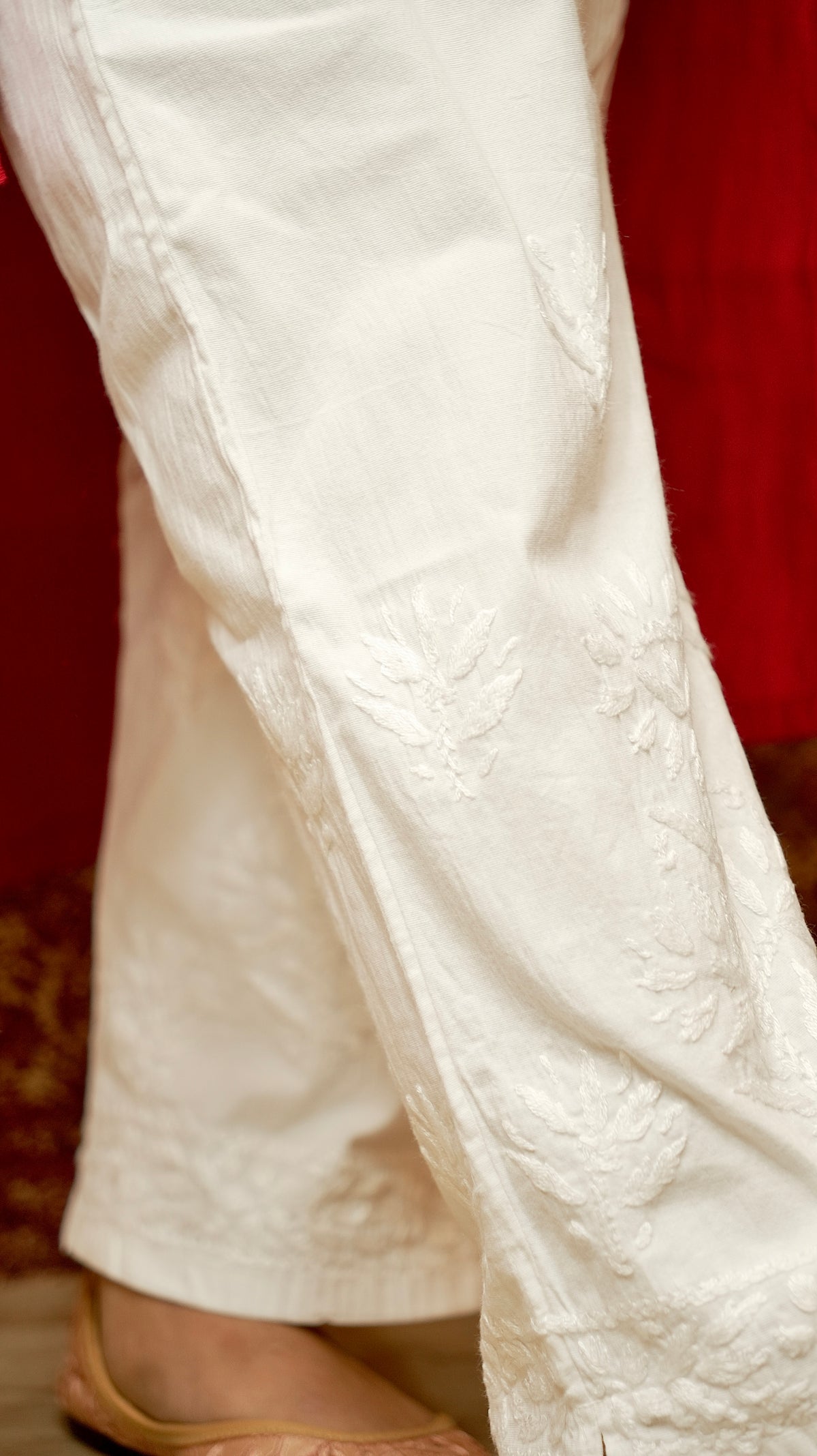 Close-up of comfortable cotton lycra pants with subtle embroidery. View stylish women's bottoms, trending cotton pants.