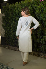 The back view shows a woman in a white long kurti with a single green embroidered paisley design on the upper back.