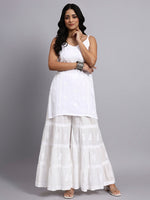 Front view of Woman wearing a white outfit with a plain background