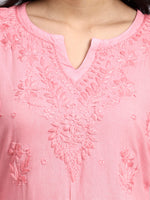 Close-up of a pink embroidered garment