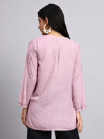 Back View of Woman wearing a pink Short Kurta with a subtle design on a gray background