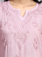 Close-up of a pink embroidered kurta.